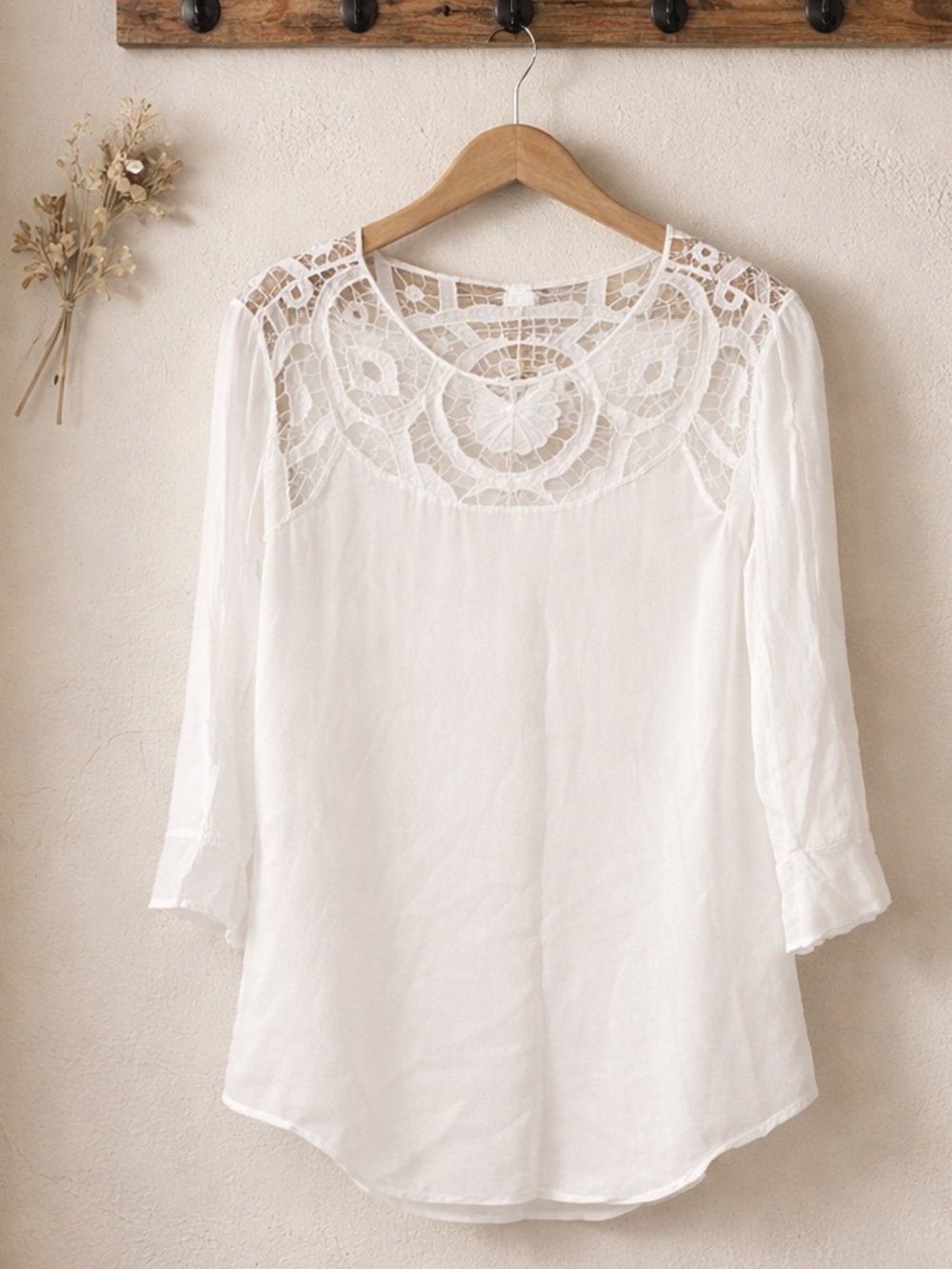 Chico’s delicate white lace garment with a fine open stitch construction